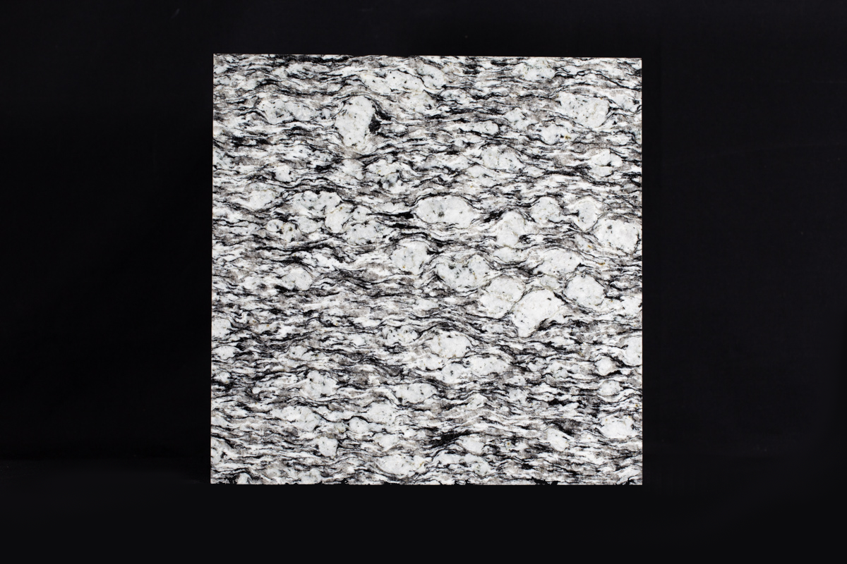 Augen gneiss, a metamorphic rock with white feldspars ‘eyes’, black biotite mica and colourless quartz.