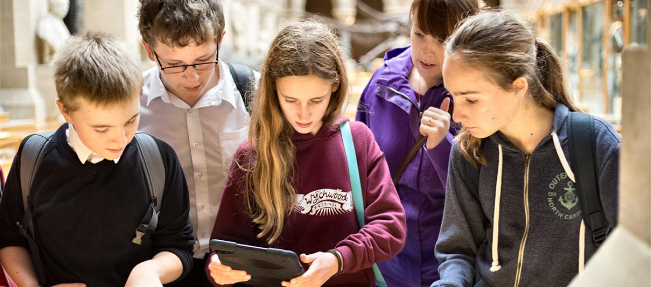 Students using a tablet at the Museum